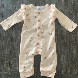 Beige baby jumpsuit.